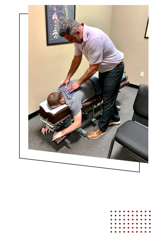 Chiropractor Green Bay WI Bill Binsfeld Adjusting Patient